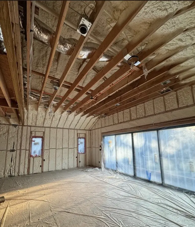 Interior walls and ceiling insulated with spray foam during new construction in Fall River